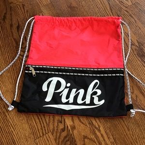 PINK backpack with drawstring color coral with black and lettering white